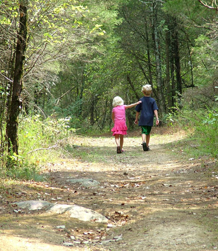 Brother and Sister Walking in the Woods